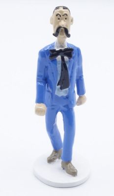 a figurine of a man in a blue suit and tie
