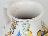 a white vase with a blue and yellow design on it
