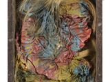 a close up of a piece of art in a wooden box