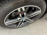 a close up of a car tire with a measuring tape on it