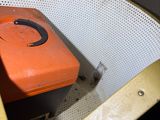 an orange box sitting on top of a white chair