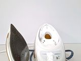 an iron and an ironing board sitting on a table