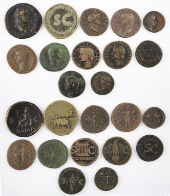 an image of a collection of old coins on a white surface