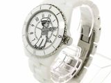 a close up of a white watch with a skeleton on it