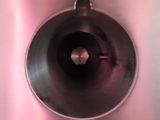 a close up view of a toilet with a metal tank