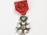 a medal with a star on it on a white surface