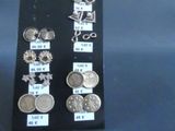 a lot of different types of earrings on display