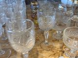 a table with many glasses and a pitcher on it