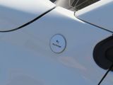 a close up of a white car with a google logo on it