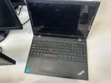 a laptop computer sitting on a desk next to a monitor