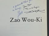 an open book with a handwritten title on the cover
