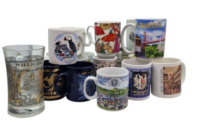 many different types of coffee mugs sitting on a table