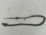a close up of a green rope with a hook on it