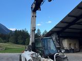 a forklift that is parked in front of a building