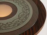 a glass table with a circular design on top of it