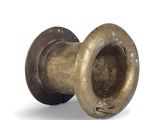 a small brass vase with a hole in it