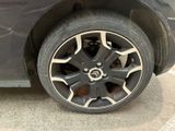 a close up of a tire on a car ' s rim