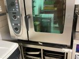 a large commercial oven sitting in a kitchen next to a sink