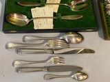 a box with a set of silverware in it on a table