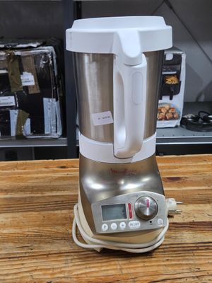 a blender that is sitting on a wooden table