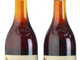 two bottles of cremus tomatia and a bottle of tomatia