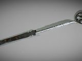 a knife that is laying on a table