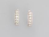 a pair of diamond hoop earrings