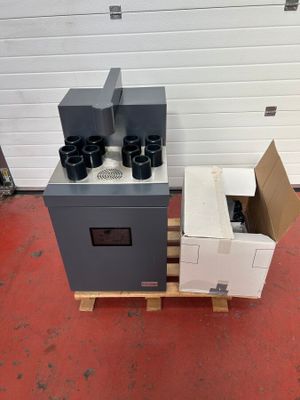 a stove and a box on a pallet in a garage