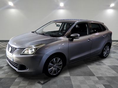 a picture of a silver car parked in a showroom