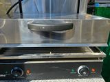 an image of a commercial grill with a large pan on top of it