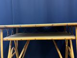 an image of a bamboo desk with a blue wall behind it