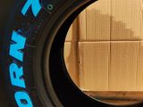 a tire that has been painted with blue lettering on it