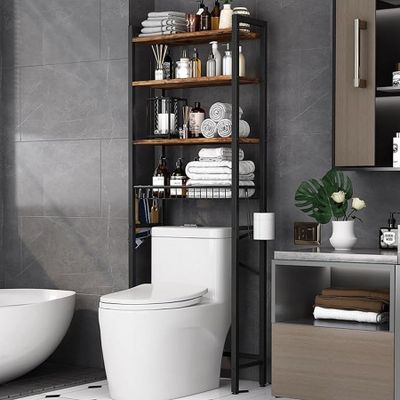 a white toilet sitting next to a bathtub in a bathroom