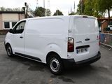 a white van that is parked in a parking lot