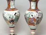 two vases sitting side by side on a table