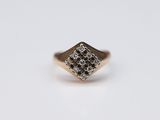 a close up of a gold ring with diamonds on it