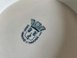 a close up of a plate with a logo on it