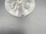 a wine glass that is sitting on top of a table
