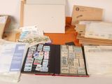 many different types of stamps and envelopes laid out on a table
