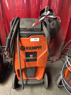 a machine that is sitting in the garage with other equipment