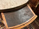 a small table with a marble top on a rug