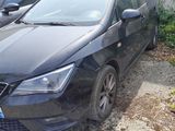 a picture of a black car parked in a parking lot
