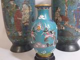 three vases that are sitting on a table