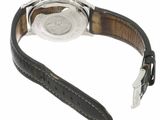 an image of a close up of a wrist watch with a leather strap
