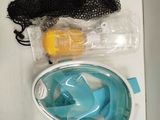 a pair of snorgs, a mask, and a bag on a table