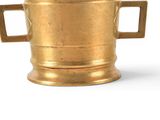 a gold vase with two handles on a white background