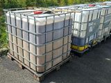 two large containers sitting on top of a pallet