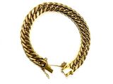 a close up of a gold chain bracelet on a white background