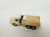 a toy truck that is sitting on a white surface