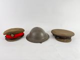 three hats and a hat cap are sitting on a white surface
